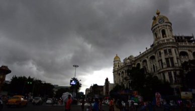 Dark thunderstorm clouds over Kolkata skyline with lightning and gusty winds as rain approaches, representing West Bengal weather update and Kalbaisakhi storm conditions