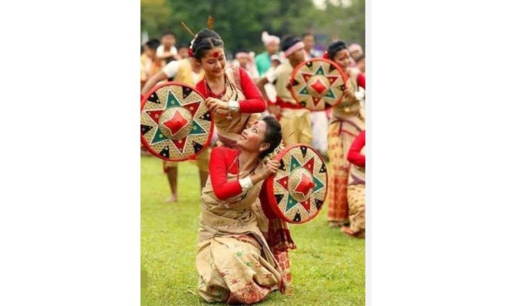 People celebrating Rongali Bihu in Assam with traditional dance, music, and Goru Bihu cattle rituals