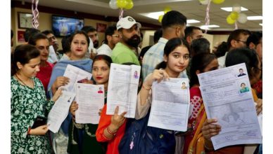 Devotees standing in long queues at bank counters in Jammu for Amarnath Yatra registration 2026