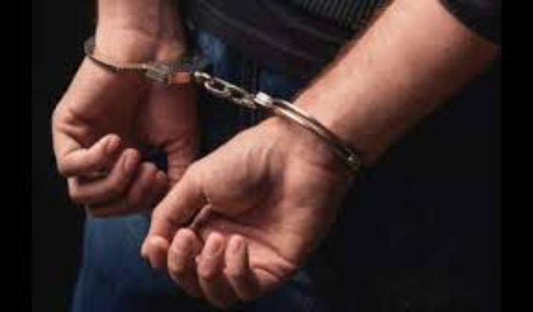 Police personnel detaining suspects during Sopore protest vandalism crackdown in Jammu and Kashmir