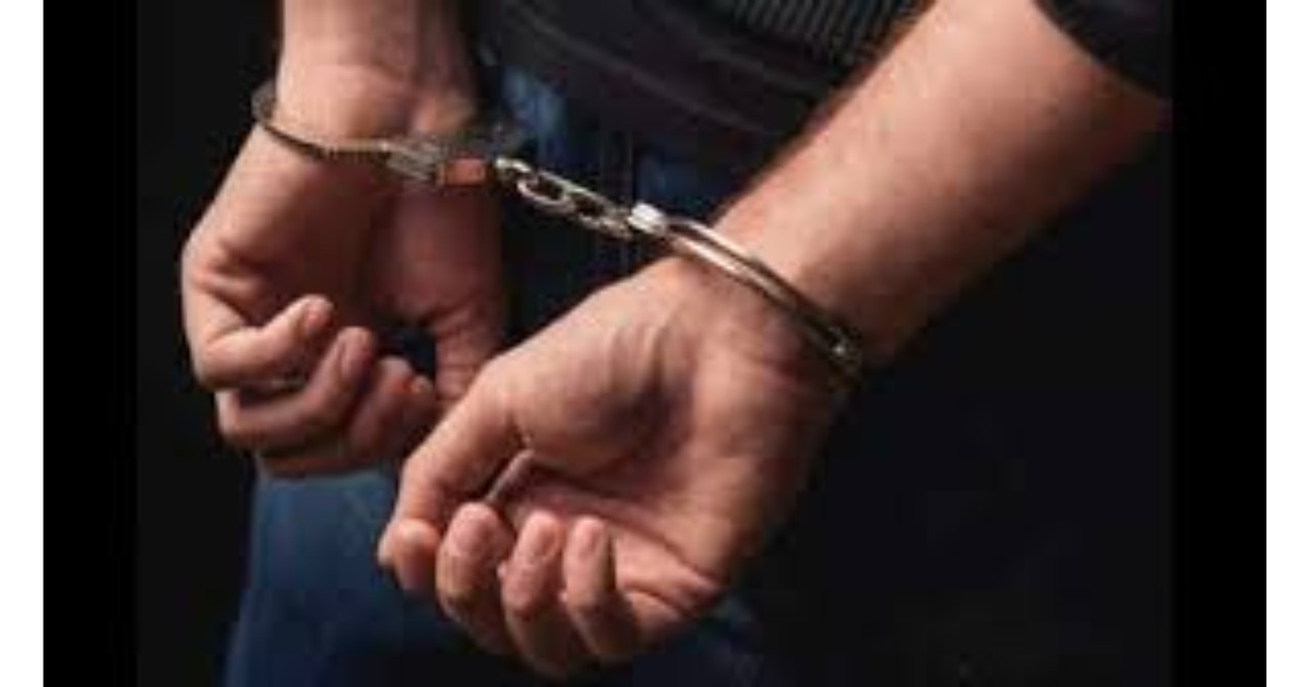 Police personnel detaining suspects during Sopore protest vandalism crackdown in Jammu and Kashmir