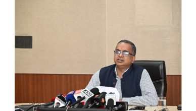 Assam voters standing in line at polling station during assembly elections