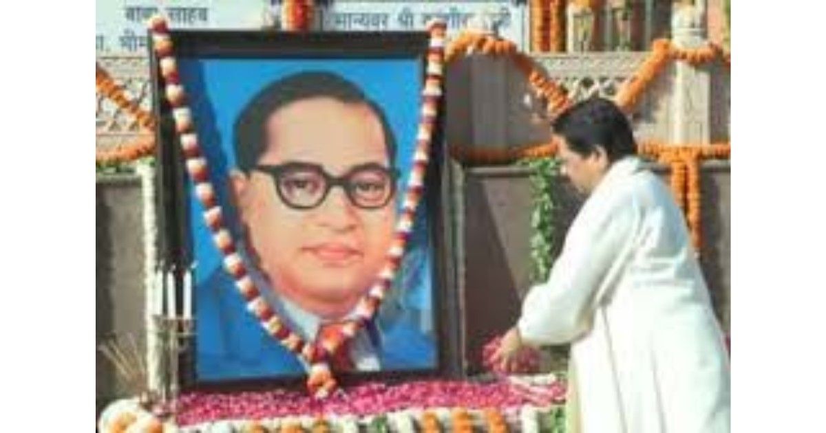 Mayawati paying floral tribute to Dr BR Ambedkar on Ambedkar Jayanti in Lucknow with supporters gathered nearby