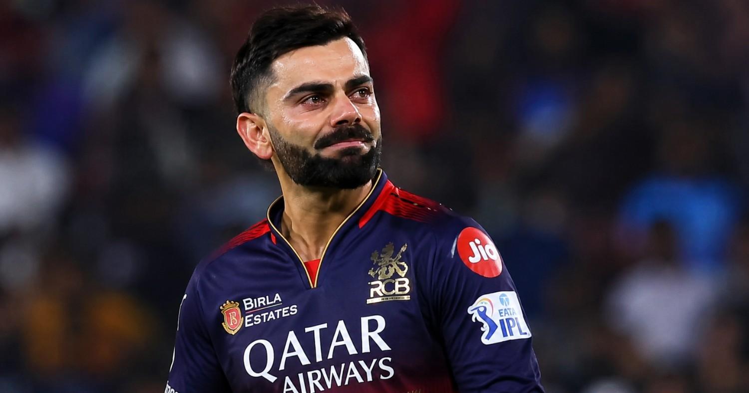 “Virat Kohli showing an emotional reaction during an IPL match as fans cheer in the stadium”