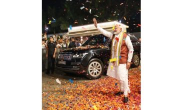 BJP workers celebrate early election leads in West Bengal and Assam as PM Narendra Modi prepares to address party headquarters in New Delhi