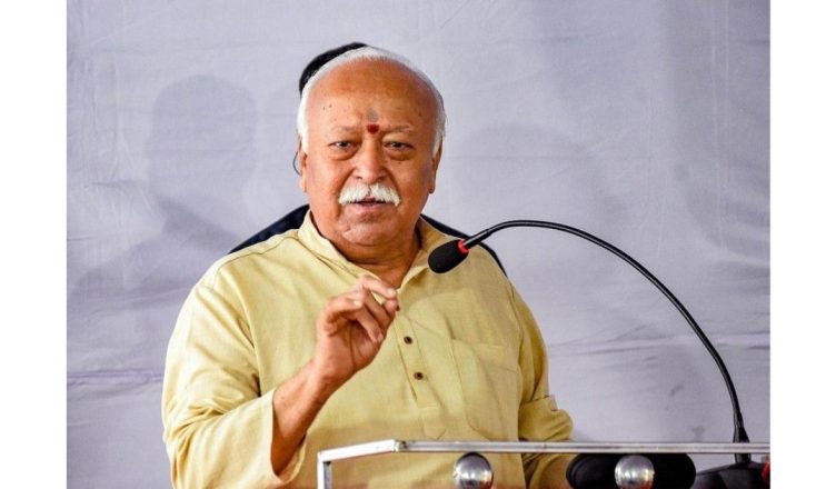 “Mohan Bhagwat arriving in Assam for RSS training camp visit in Hojai with volunteers gathered at the programme venue”