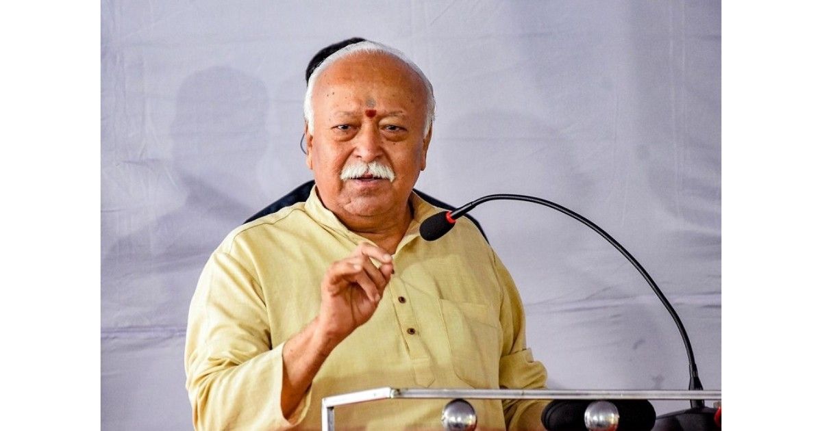 “Mohan Bhagwat arriving in Assam for RSS training camp visit in Hojai with volunteers gathered at the programme venue”